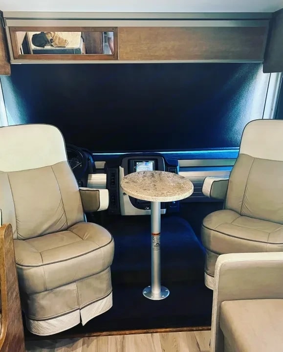 Captain's chairs with a small round pedestal table between them