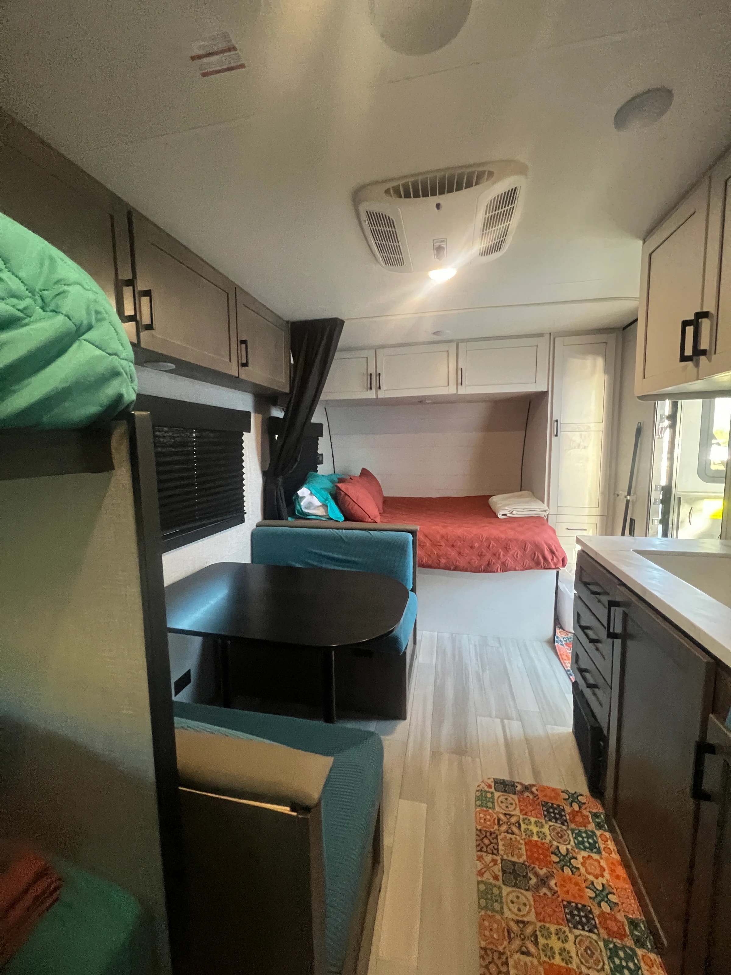 Looking from the galley past the booth dinette to the front queen bed
