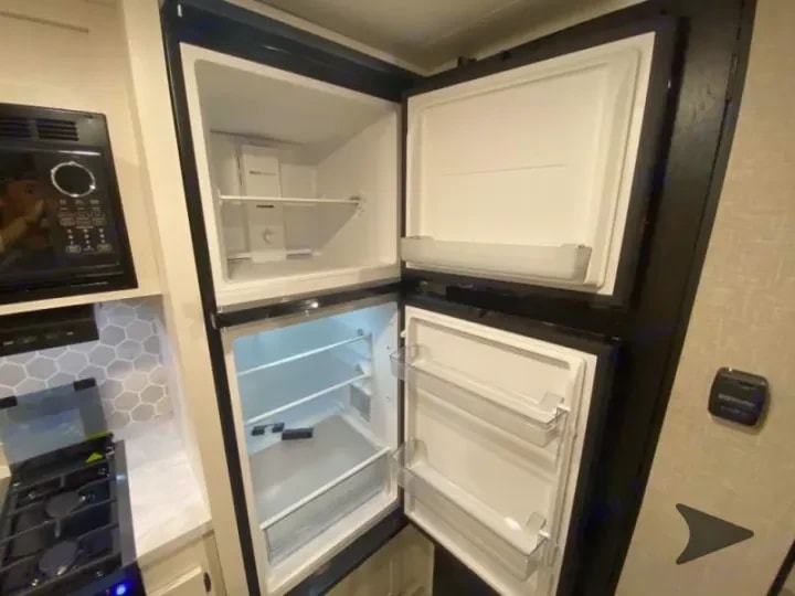 Close-up of the open refrigerator and freezer compartments