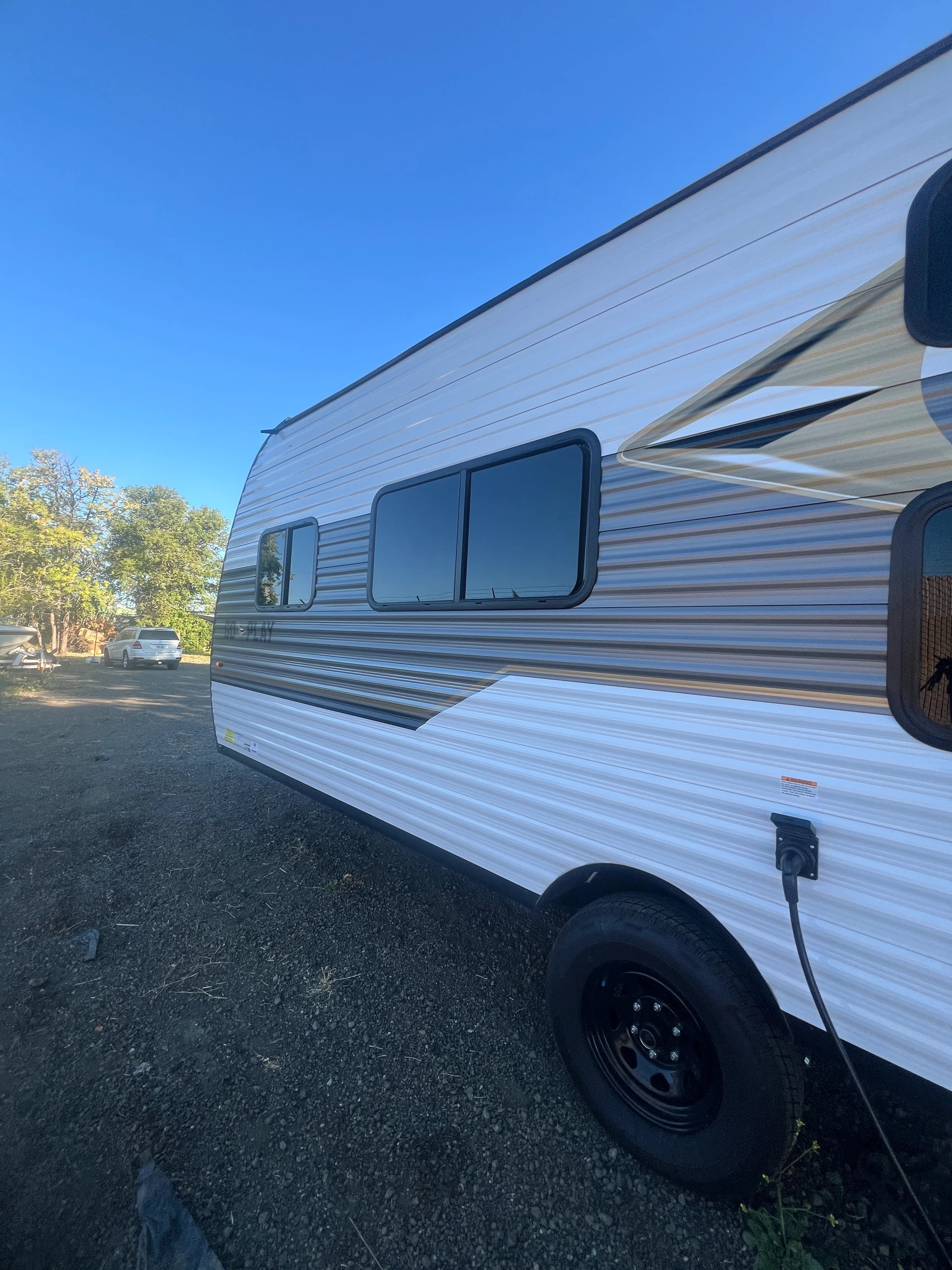 Door side of the trailer in the yard on a clear morning
