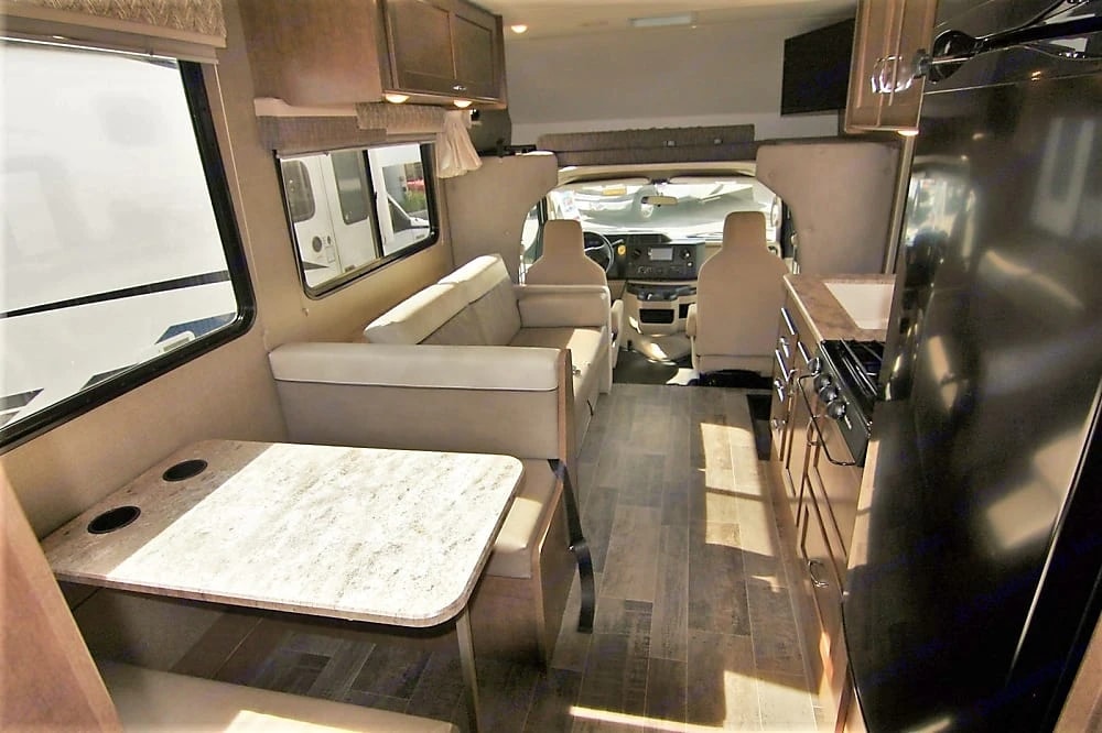 View from the dinette down the coach toward the cab and driver's seats