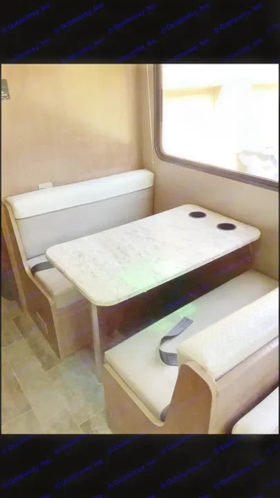 Dinette booth with table and cushioned bench seating