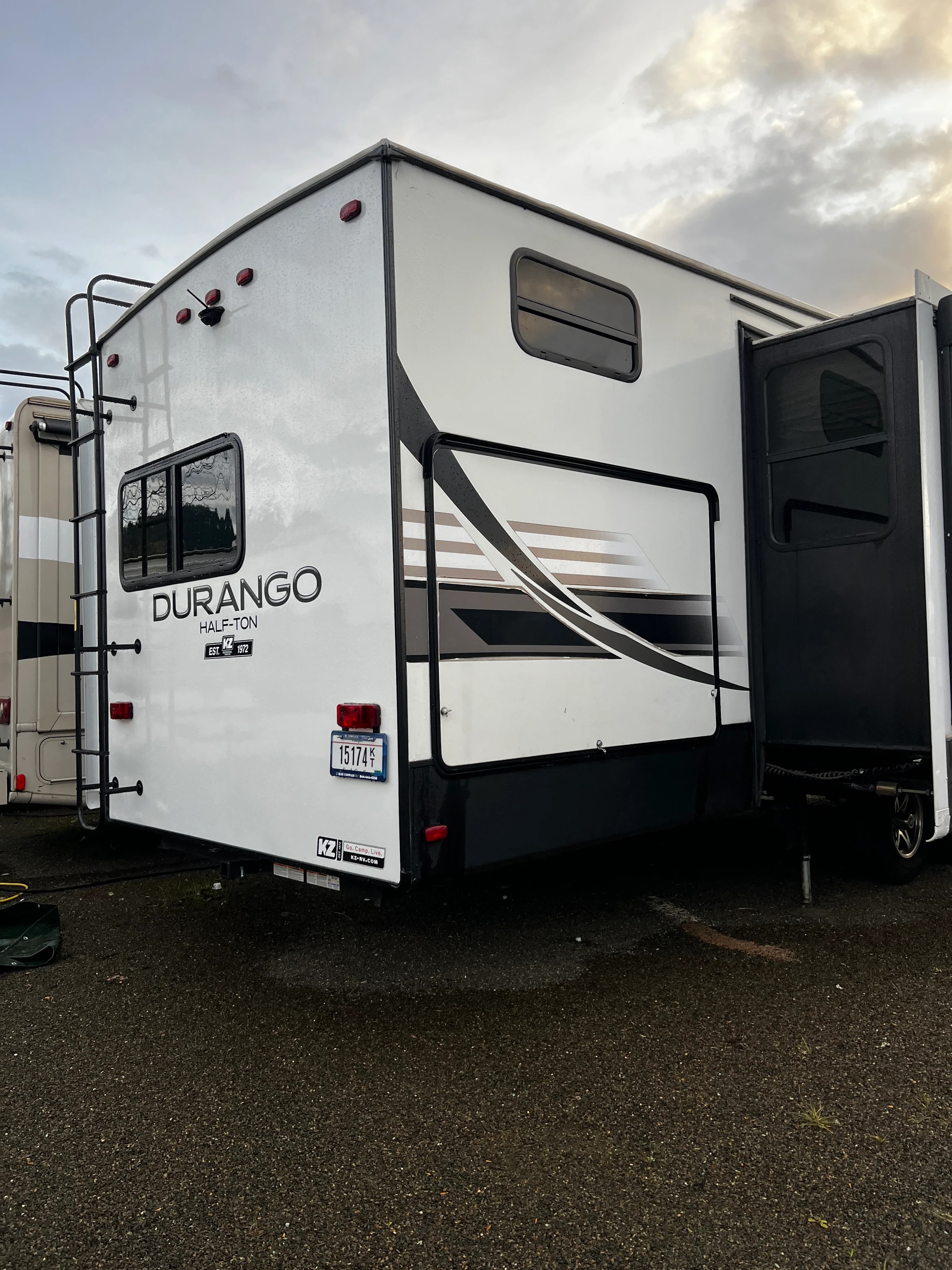 Rear three-quarter view of the Durango parked in the yard