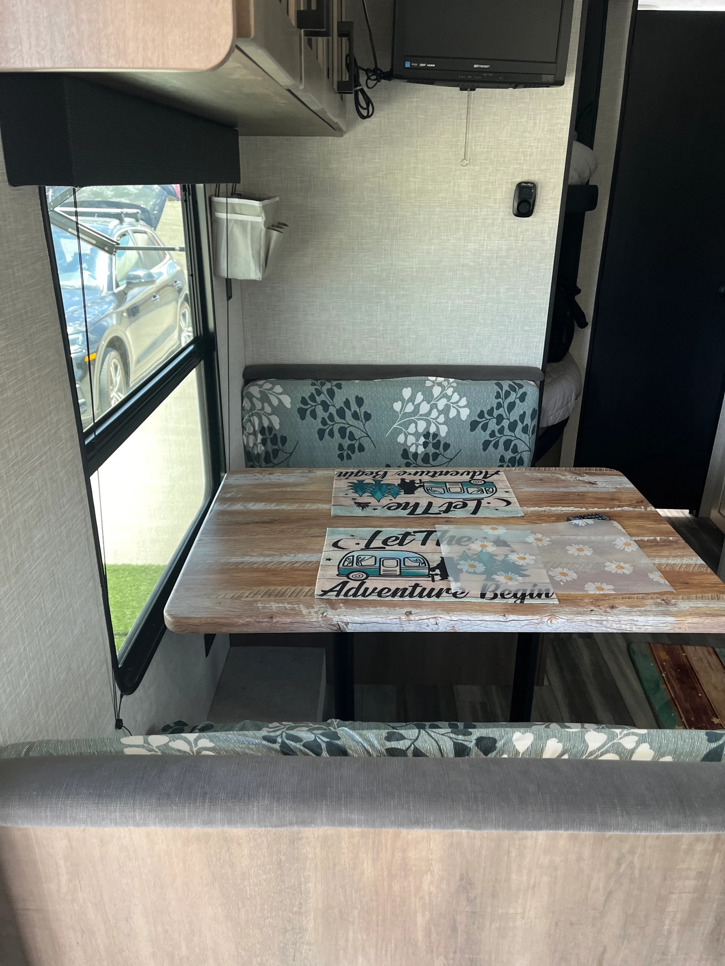 Bunk area with overhead skylight and patterned cushions
