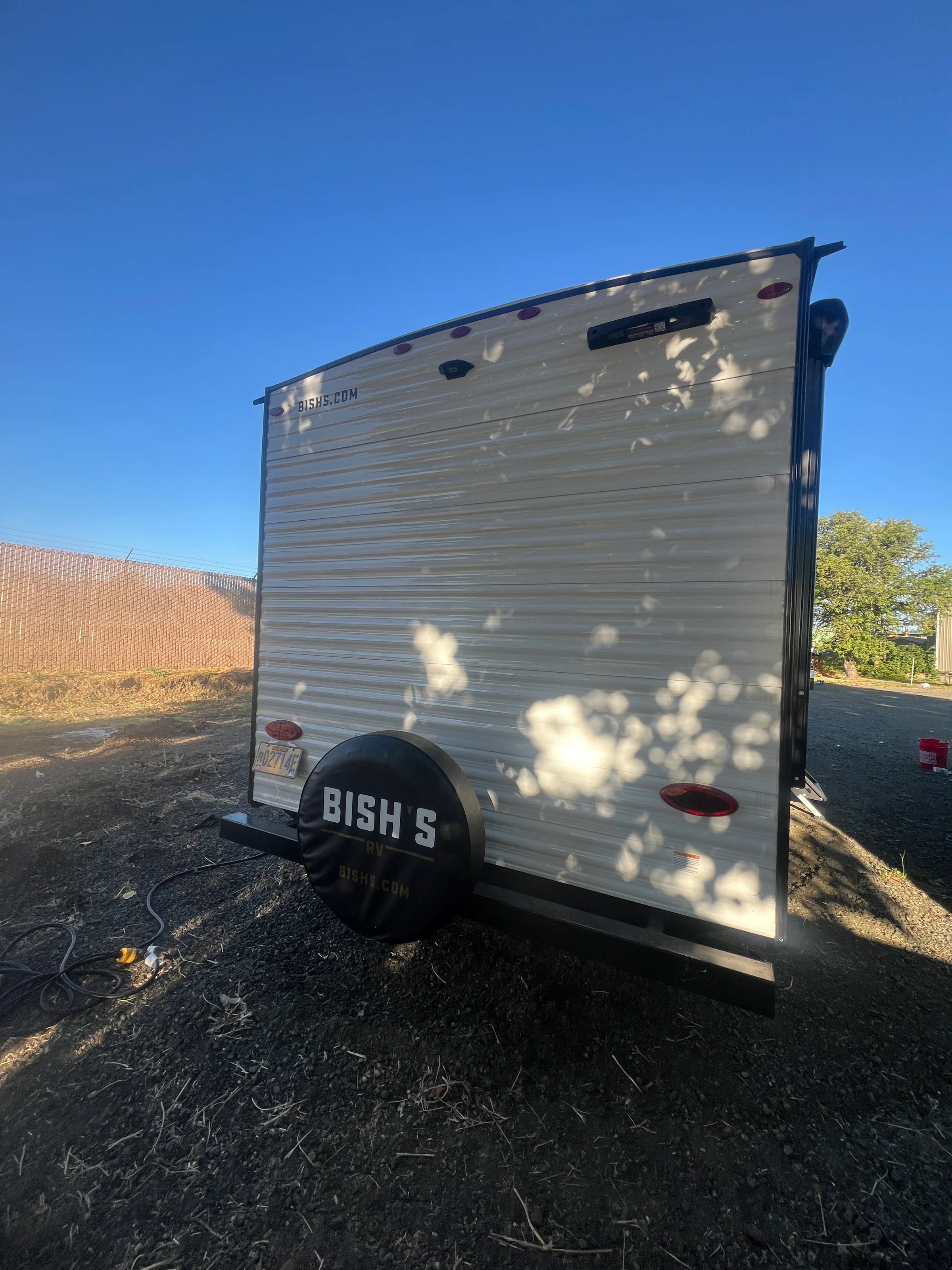 Back of the trailer with its spare wheel cover