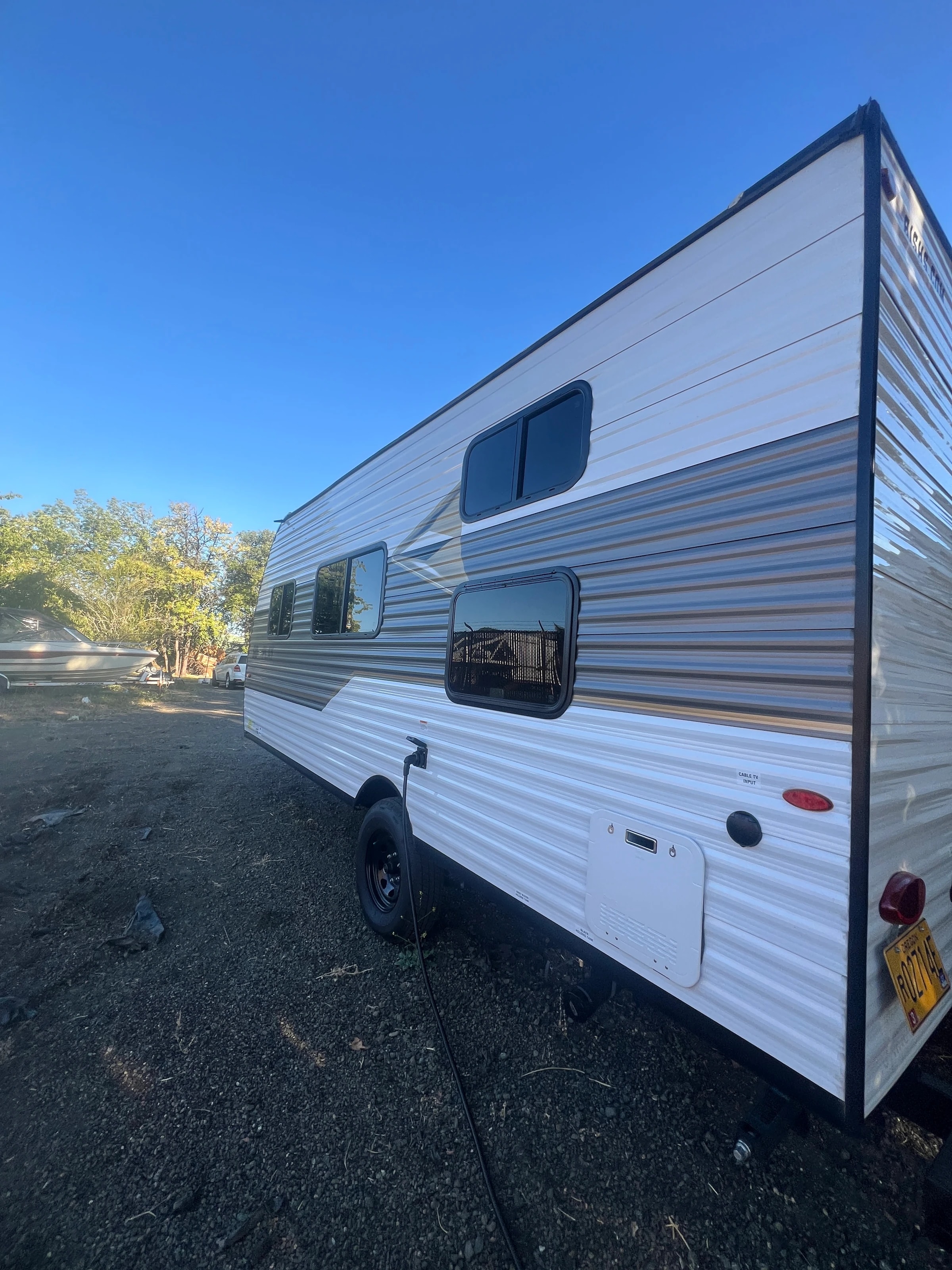 Off side of the trailer showing the bunk and dinette windows