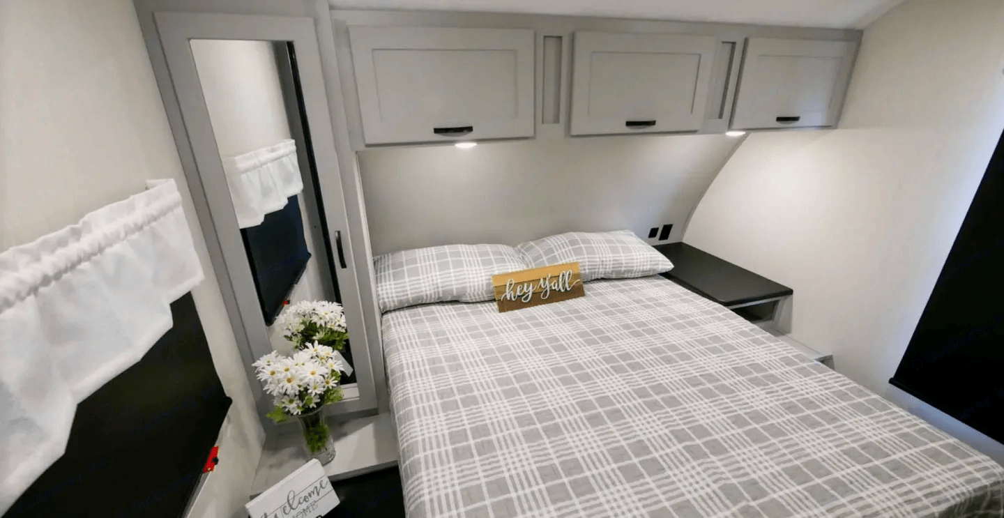 Bed made up in the rear bedroom